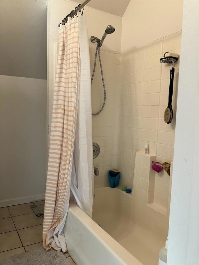 full bath featuring tile patterned flooring and shower / bath combo with shower curtain