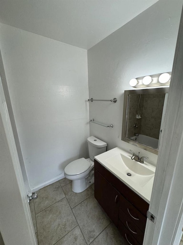 full bathroom featuring toilet, tile patterned flooring, walk in shower, and vanity