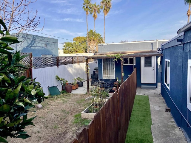 view of yard featuring a fenced backyard and a vegetable garden