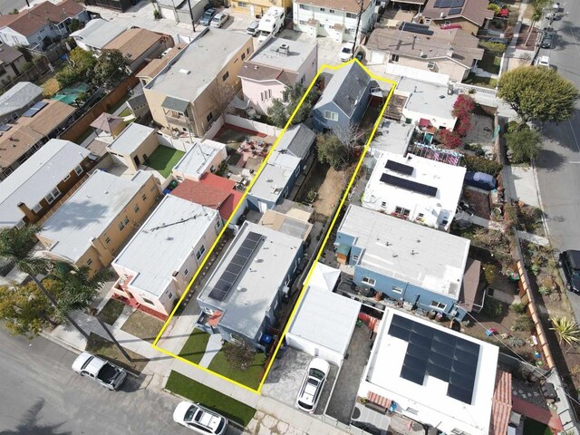 birds eye view of property with a residential view