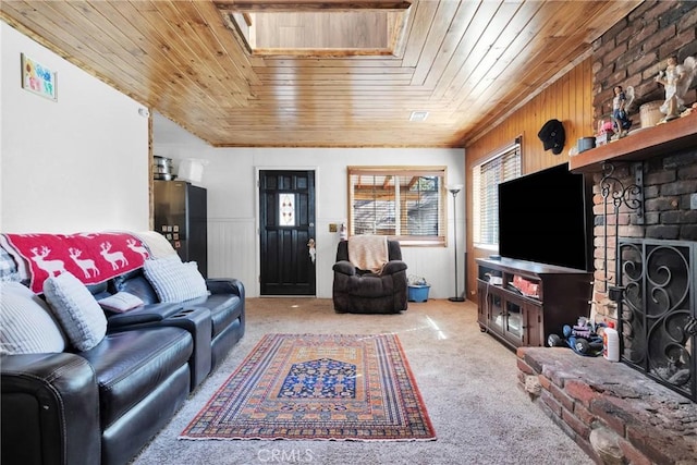 living room with wood ceiling, a fireplace, and carpet flooring