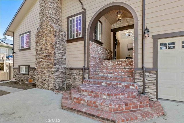 property entrance featuring stone siding