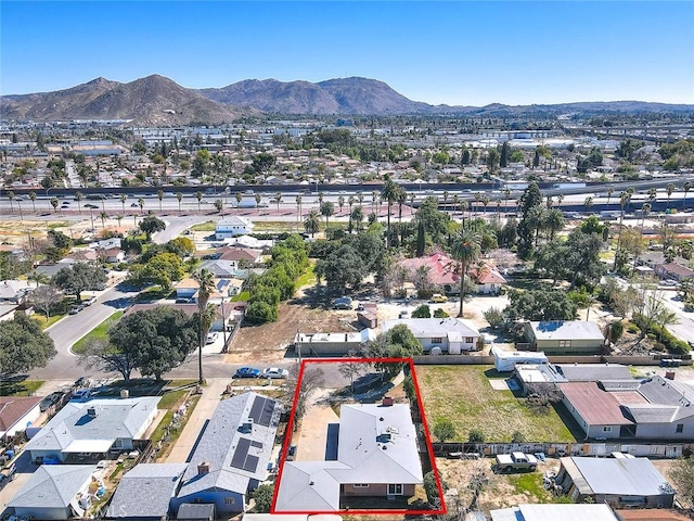 drone / aerial view featuring a residential view and a mountain view