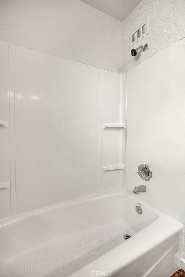 full bath featuring shower / bath combination and visible vents