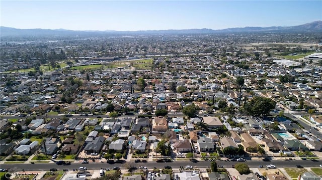 birds eye view of property with a residential view and a mountain view