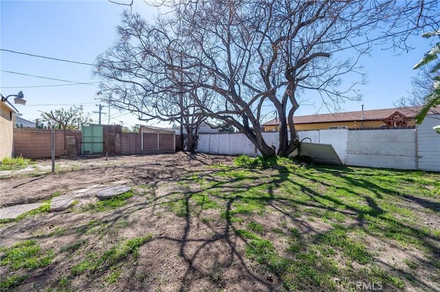 view of yard with a fenced backyard