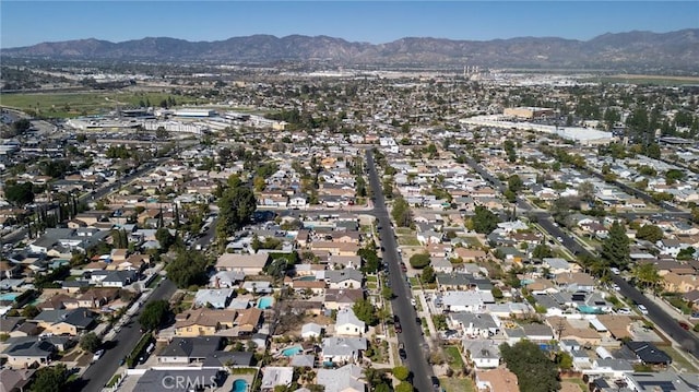 drone / aerial view with a residential view and a mountain view