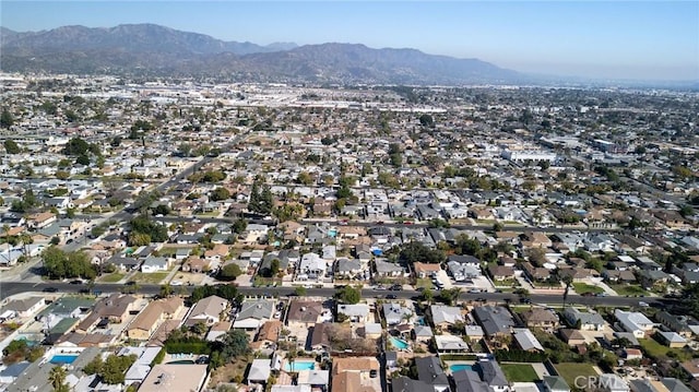 birds eye view of property with a residential view and a mountain view