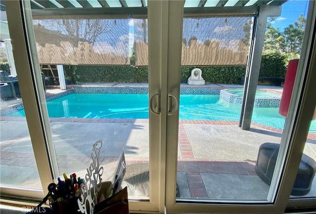 view of swimming pool with a pool with connected hot tub