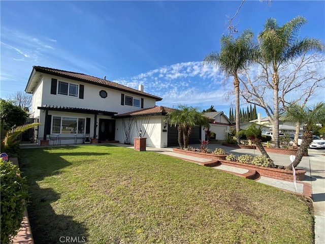 mediterranean / spanish-style home with an attached garage, stucco siding, a tiled roof, and a front yard