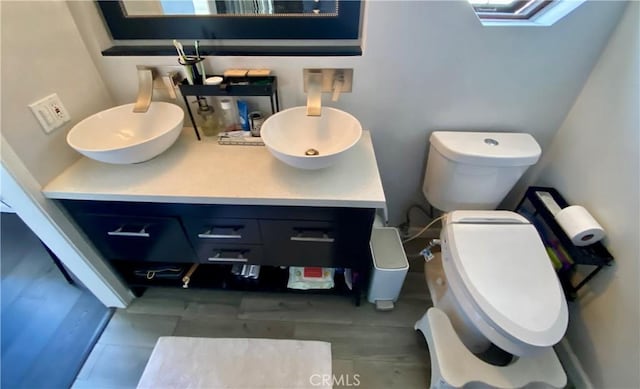 bathroom featuring vanity and toilet