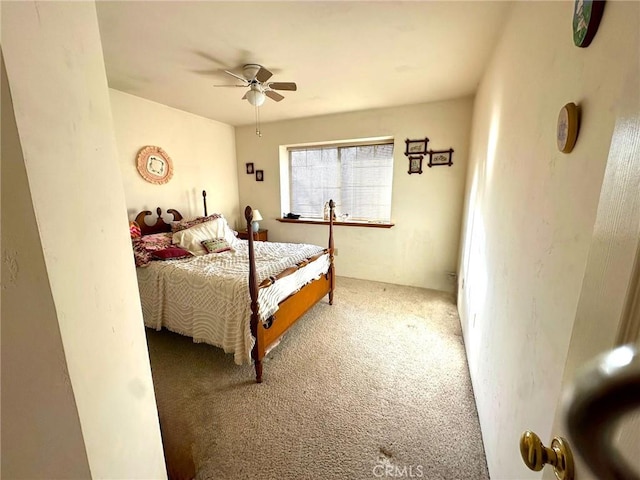 carpeted bedroom with a ceiling fan