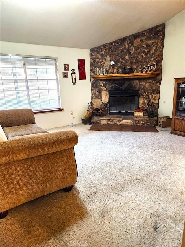 carpeted living area featuring a fireplace