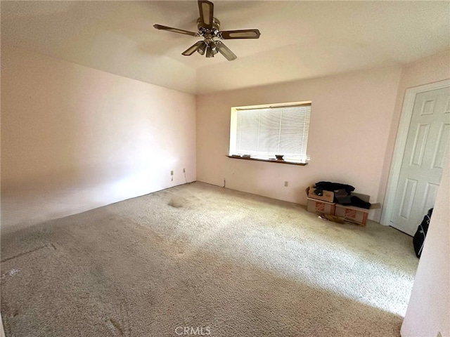 unfurnished bedroom featuring carpet and ceiling fan