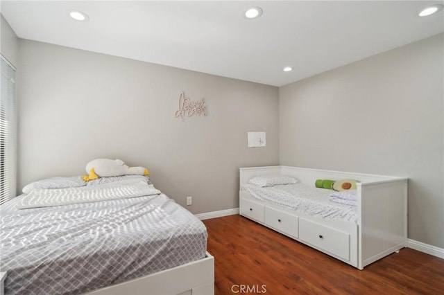 bedroom with recessed lighting, baseboards, and wood finished floors