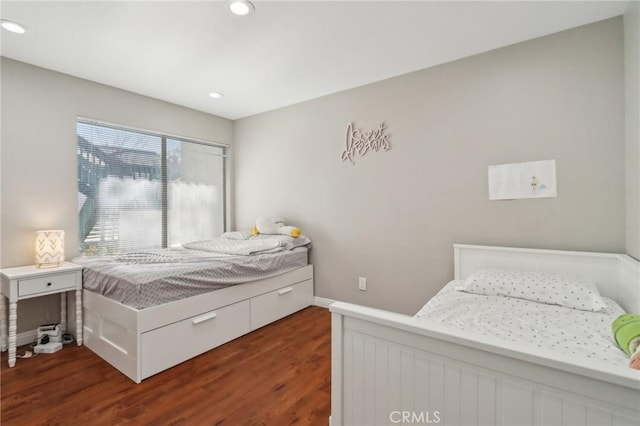 bedroom featuring recessed lighting, wood finished floors, and baseboards