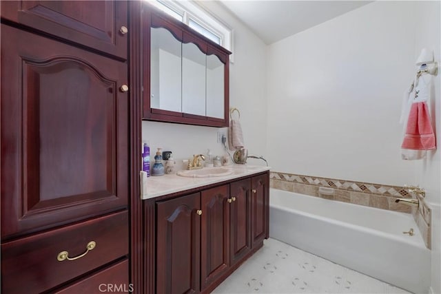 full bathroom featuring vanity and a bath