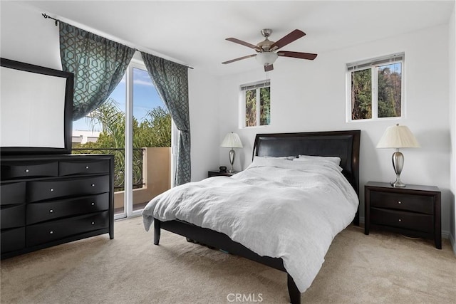 bedroom featuring light carpet, ceiling fan, and access to exterior