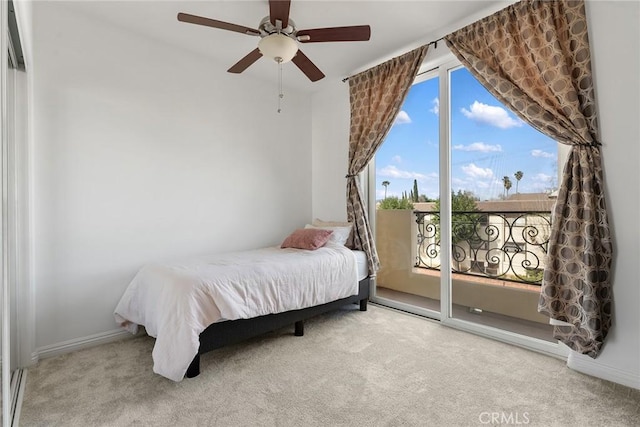 bedroom with a ceiling fan, light carpet, and baseboards