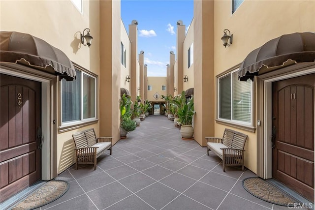 property entrance with stucco siding