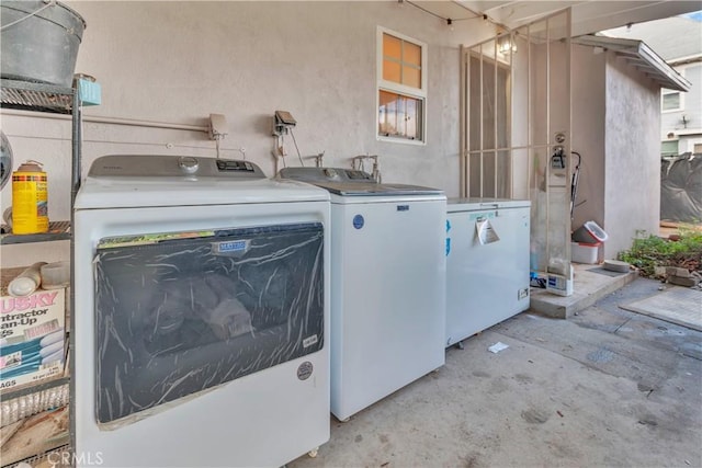 laundry area featuring laundry area and separate washer and dryer