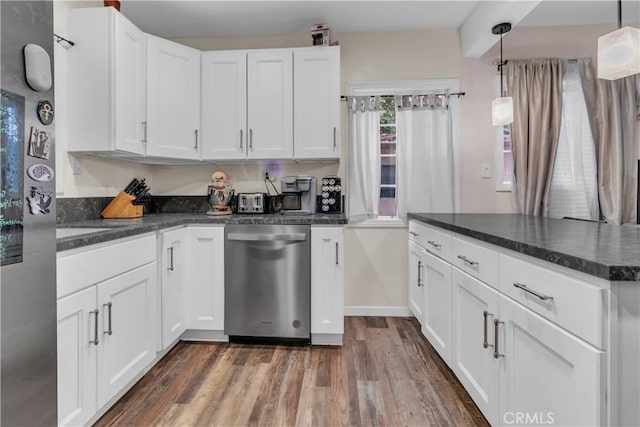 kitchen featuring dark wood-type flooring, white cabinetry, dishwasher, beamed ceiling, and pendant lighting