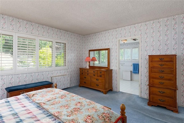 bedroom featuring light carpet, wallpapered walls, and a textured ceiling