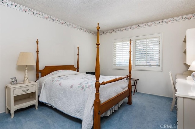 bedroom featuring a textured ceiling and carpet floors