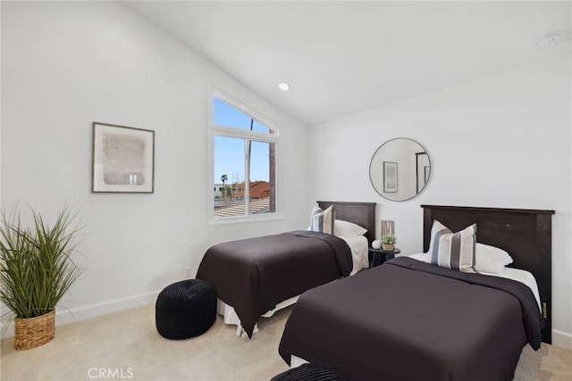 bedroom with light carpet, baseboards, and lofted ceiling