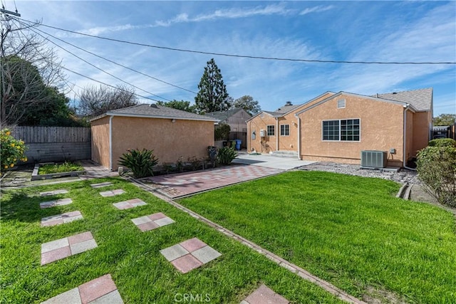 3722 Degnan Blvd, Los Angeles, CA 90018 - back of property featuring cooling unit, a patio area, stucco siding, and an outdoor structure