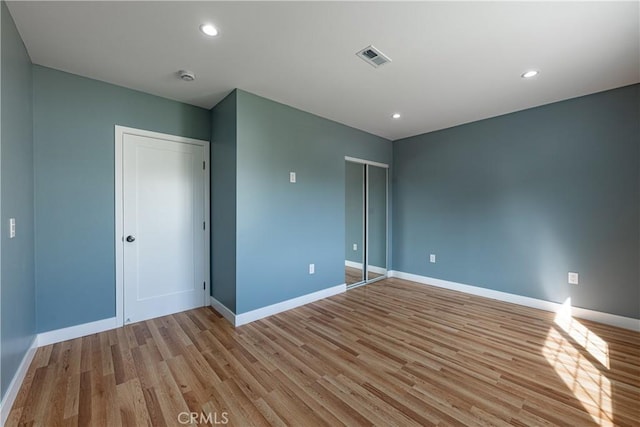 3722 Degnan Blvd, Los Angeles, CA 90018 - unfurnished bedroom featuring light wood-style floors, baseboards, and recessed lighting