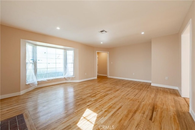 3722 Degnan Blvd, Los Angeles, CA 90018 - unfurnished room with light wood-type flooring, baseboards, and recessed lighting