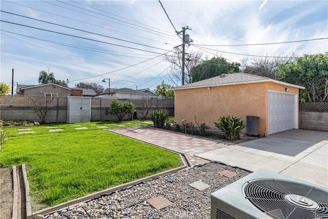3722 Degnan Blvd, Los Angeles, CA 90018 - view of yard with an outbuilding, cooling unit, a detached garage, and concrete driveway