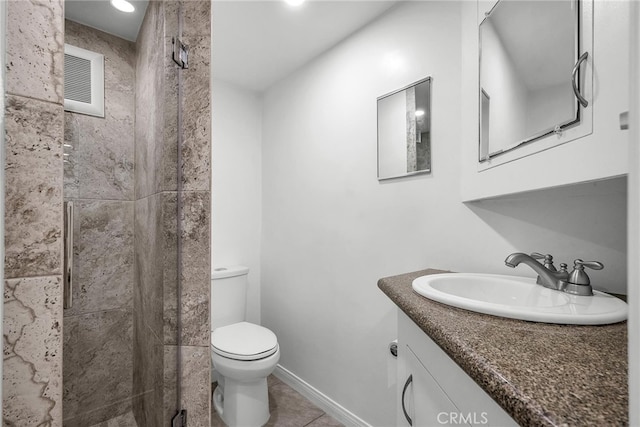 full bathroom with visible vents, toilet, a stall shower, vanity, and tile patterned flooring