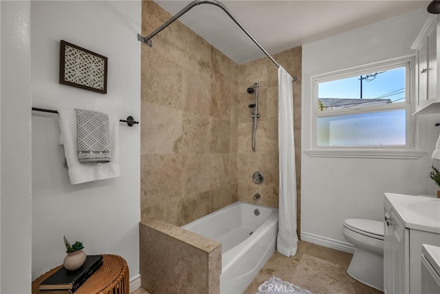 bathroom featuring toilet, baseboards, shower / bath combination with curtain, and vanity