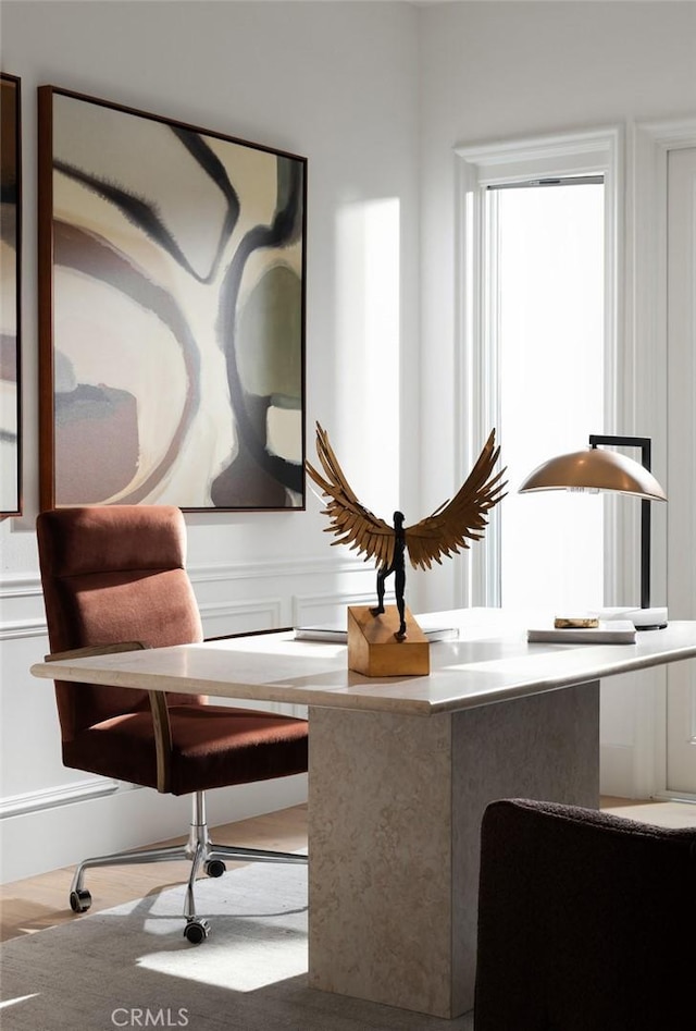 sitting room featuring a decorative wall