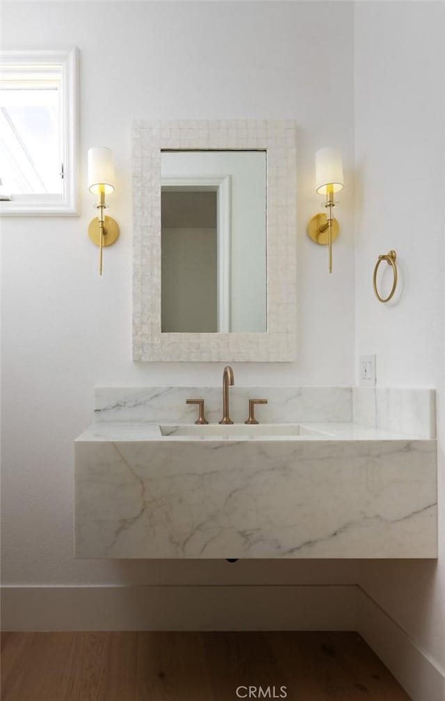 bathroom with vanity and wood finished floors