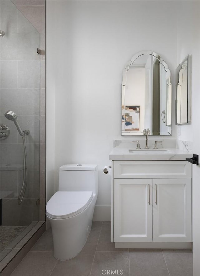 full bathroom featuring toilet, tile patterned flooring, a shower stall, and vanity