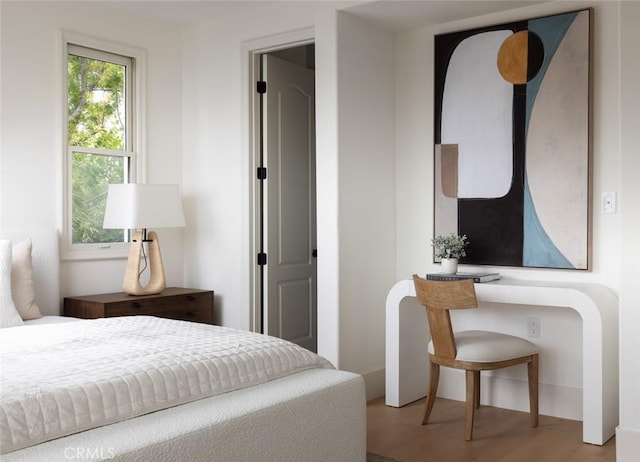 bedroom with wood finished floors