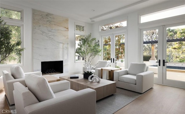 sunroom / solarium with french doors and a fireplace