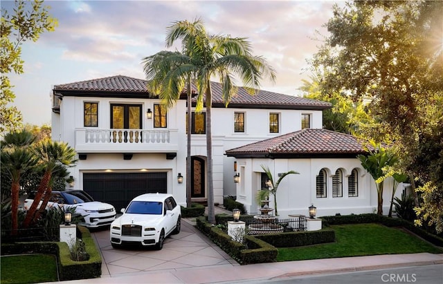 31 Vista Tramonto, Newport Coast, CA 92657 - mediterranean / spanish house with driveway, stucco siding, a balcony, and a garage