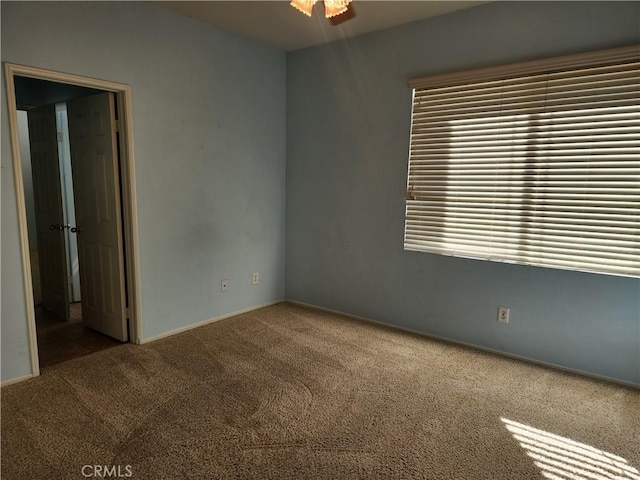 empty room with carpet flooring