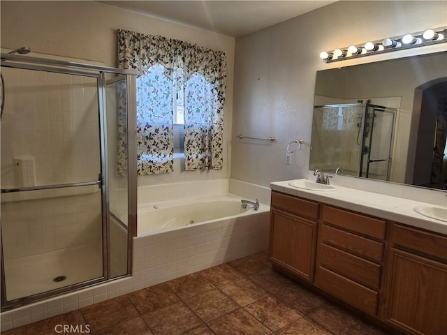 bathroom with a sink, a shower stall, a tub with jets, and double vanity