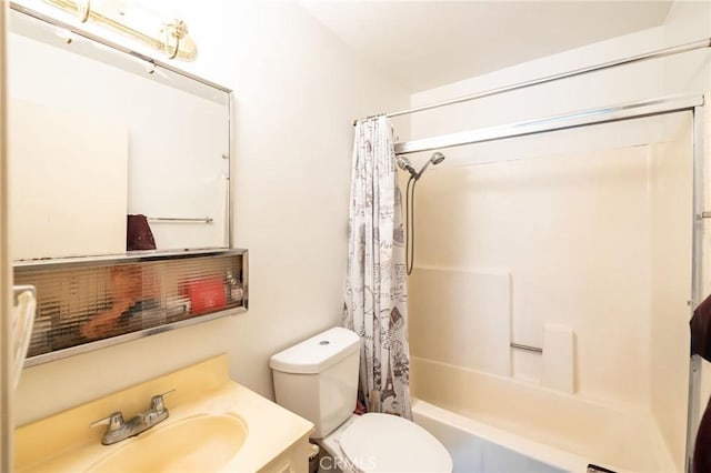 bathroom with vanity, toilet, and shower / bath combo with shower curtain