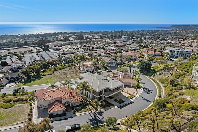 bird's eye view with a water view and a residential view