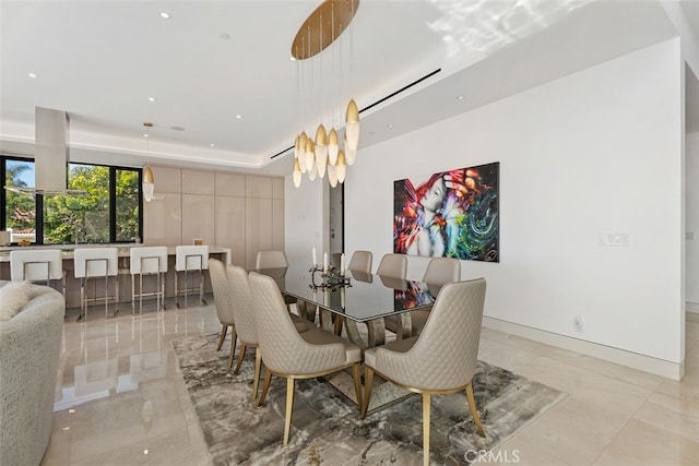 dining area featuring recessed lighting and baseboards