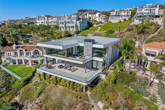 birds eye view of property with a residential view