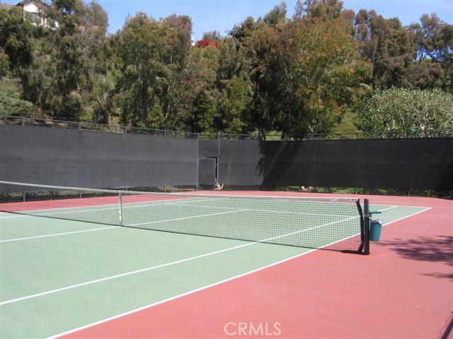 view of sport court with fence