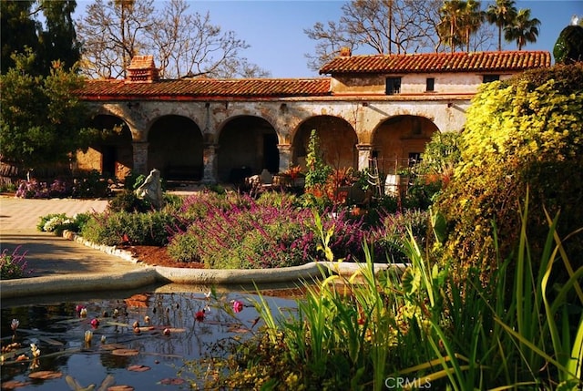 exterior space featuring a tile roof