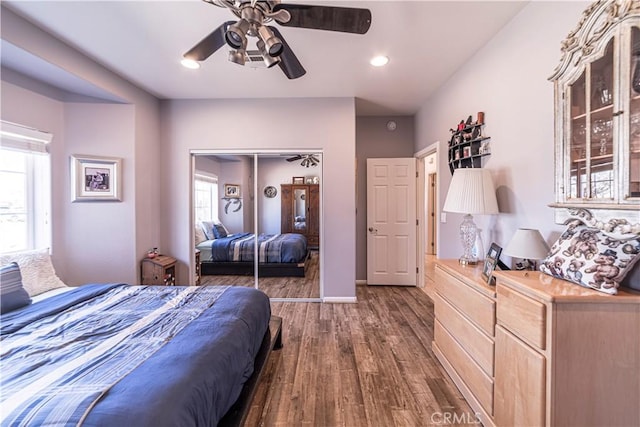 bedroom featuring recessed lighting, a closet, dark wood-type flooring, a ceiling fan, and baseboards